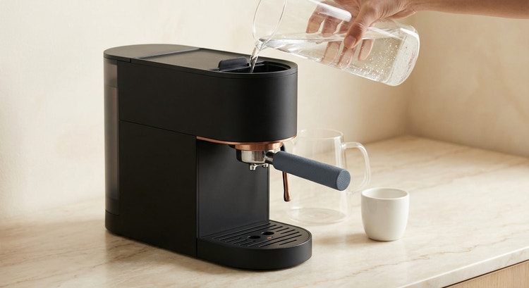 A glass of crystal-clear water beside a freshly pulled espresso shot
